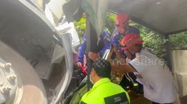 Concrete truck plunges down hill onto roof of coffee shop in Phuket