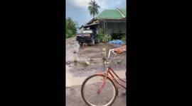 Failed wheelie attempt on bicycle in Palembang, Indonesia