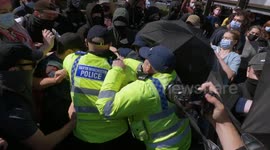 Clashes in Manchester as masked-up counter-protesters try to block Britain First from marching