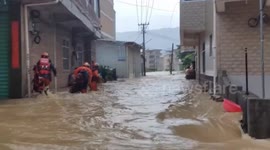 China: Rescuers evacuate people trapped in flooded home in Fujian