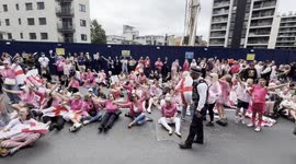 Anti Migrant Protestors sing Sweet Caroline as they block the road outside the Britannia International Hotel