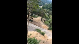 Man rides electric unicycle up and down slanted wall in Sichuan, China
