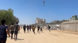 Palestinians risk their lives for airdropped aid in Gaza amid deepening hunger crisis