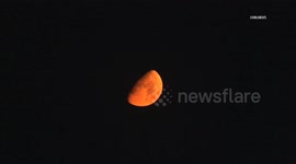 US, Los Angeles: Burbank Moon Turns Red From Gifford Fire Smoke