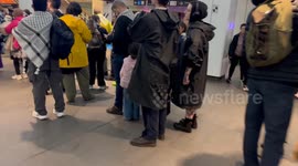 Long queue for toilets at Wynyard station as thousands arrive for Palestine bridge march, Sydney, Australia