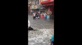 Flooded streets and daily struggles after first rain in Sangam Vihar, Delhi, India