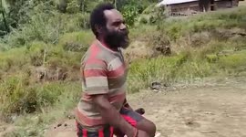 Papuan tribesmen stages skit saluting Indonesian flag
