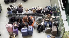 Stranded passengers find places to rest after Eurostar services from St Pancras international severely delayed