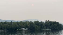 Sunset Over Moosehead Lake, Greenville, Maine – August 3,  2025 showing the haze from the Canadian Wildfires