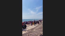 Fisherman hold ceremony to bury 40ft long Bryde's whale found dead near beach