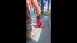 Toddler Plays With a Lizard