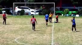 Footballer given a red card attacks referee and chases him across the pitch