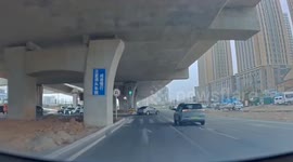 Mini electric car spins 180 degrees while turning onto road