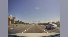 Flat pack furniture flies off trailer and hits car behind