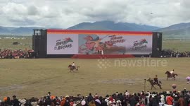 Rider leans back for speed boost during horse race in Sichuan, China