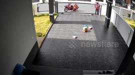 Kind deliveryman tidies parcels scattered across resident's driveway