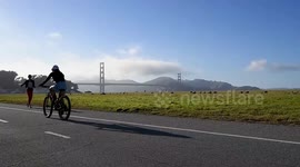 US: San Francisco residents flock to coastline for sunset and summer weather