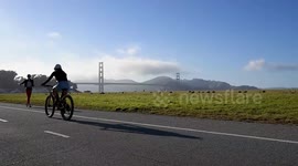 San Francisco residents flock to coastline for sunset and summer weather
