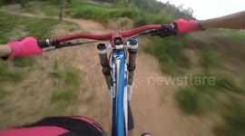 Female Downhill Rider Crashes Into Tree Just Seconds Into Her Run