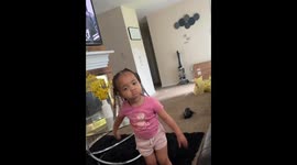Little girl repeats curse words while laughing in Suffolk, England, UK