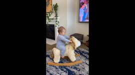Toddler’s rocking lion ride ends in hilarious tumble and cries
