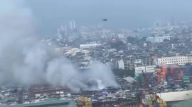 Air Force battles huge fire sweeping through slum in the Philippines