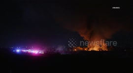 US, Phoenix: Avondale Crews Battle Agua Fria River Bottom Brush Fire