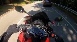 Close motorcycle crash on winding road in Bratislava, Slovakia