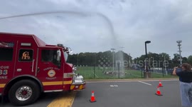 Fairfax High Band Gets Fire Hose Cooldown After Practice