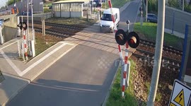 Van smashed to pieces by train after foolish driver attempted to turn around on tracks