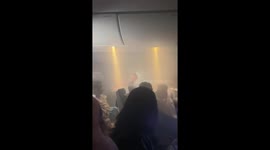 Passengers panic as phone charger catches fire on flight to Amsterdam