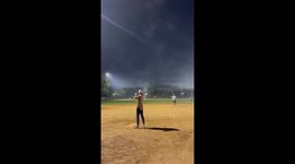Baseball swing perfectly timed with fireworks burst in Chicago, Illinois, USA
