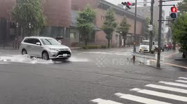 Heavy rain floods road near Kanazawa Izumino Library in Ishikawa, Japan