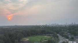 Hazy wildfire smoke sunset in Cambridge, Massachusetts