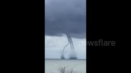 Twin Waterspouts Merge Near Italian Coastline