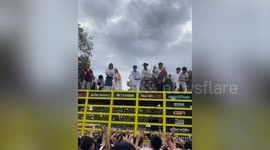 Director throws cash into crowd after movie earns 50M baht