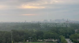 Vivid pink and red sunset with wildfire haze in Cambridge, Massachusetts