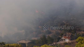 Large wildfire rages near Athens, forcing evacuations