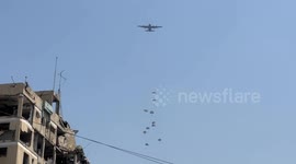 Gaza residents flock to collect air-dropped relief in blockaded Gaza
