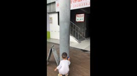 Little boy plays with anti-gravity toy car in Guangdong, China
