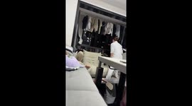 Woman falls as single sofa flips over in family room in Guizhou, China