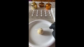 Delicious-looking pumpkin pops perfect for Halloween