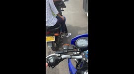 Motorcycle passenger’s shoe melts on exhaust pipe in El Banco, Colombia