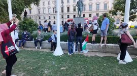 A shocking moment where protestors attending the Defend Our Juries  protest in Parliament Square appear to shout and boo as foreign school children pass through Parliament Square
