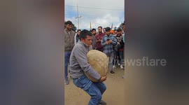 Men balance heavy stone on their body and complete brave during this ritual in northern India