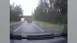 Truck skids of wet road before crashing into oncoming car