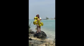 Passing boat helps to sing happy birthday to girl posing for pictures