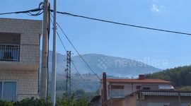 Water bombers bombing a wildfire raging on the Croatian coast