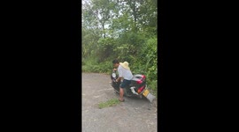 Motorcycle mishap ends in bushes in Hunan, China