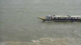 Cruise boat takes tourists up Mekong river to the Golden Triangle